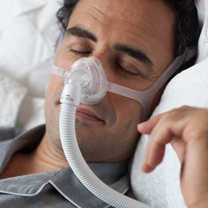 sleeping man wearing Wisp mask by respironics